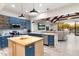 Modern kitchen with blue cabinets and island at 30017 N 60Th St, Cave Creek, AZ 85331