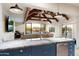 Kitchen with exposed beams and pool view at 30017 N 60Th St, Cave Creek, AZ 85331