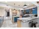 Spacious kitchen featuring granite countertops, stainless steel appliances, and blue cabinetry at 30017 N 60Th St, Cave Creek, AZ 85331