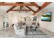 Open living area with vaulted ceilings, exposed beams, and comfortable seating at 30017 N 60Th St, Cave Creek, AZ 85331