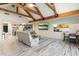 Relaxing living room showcasing exposed wooden beams and a large TV at 30017 N 60Th St, Cave Creek, AZ 85331
