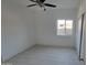 Simple bedroom with tile flooring and a window at 3021 W Almeria Rd, Phoenix, AZ 85009