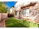 Artificial turf backyard with a patio and block wall at 3613 W Kathleen Rd, Phoenix, AZ 85053