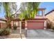 Two-story house with a two-car garage and landscaped front yard at 3613 W Kathleen Rd, Phoenix, AZ 85053