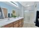 Double vanity bathroom with large shower and tiled floor at 4118 E Narrowleaf Dr, Gilbert, AZ 85298