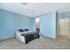 Spacious bedroom with light blue walls and en-suite bathroom at 4118 E Narrowleaf Dr, Gilbert, AZ 85298