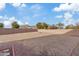 Large backyard with gravel and a fire pit area at 4642 W Alabama Ln, San Tan Valley, AZ 85144