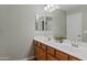 Double vanity bathroom with a large mirror and updated fixtures at 4642 W Alabama Ln, San Tan Valley, AZ 85144