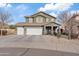 Two-story house with a three-car garage and desert landscaping at 4642 W Alabama Ln, San Tan Valley, AZ 85144