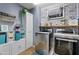 Bright laundry room features modern washer and dryer, and ample storage at 4642 W Alabama Ln, San Tan Valley, AZ 85144