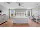 Bright main bedroom with king-size bed and built-in headboard at 4642 W Alabama Ln, San Tan Valley, AZ 85144