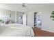 Main bedroom with king bed, access to en-suite bathroom, and walk-in closet at 4642 W Alabama Ln, San Tan Valley, AZ 85144