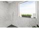 Spa-like shower with marble tile and built-in bench at 4642 W Alabama Ln, San Tan Valley, AZ 85144