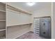 Large walk-in closet with shelving and a safe at 480 W Cucumber Tree Ave, Queen Creek, AZ 85140