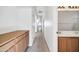 A long hallway with light walls and carpeted flooring at 4918 E Michigan Ave, Scottsdale, AZ 85254