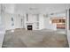 Living room with a fireplace and views into kitchen and entryway at 4918 E Michigan Ave, Scottsdale, AZ 85254