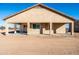 Tan house exterior with covered patio and desert landscaping at 1 N Brenner Pass Rd, Queen Creek, AZ 85144
