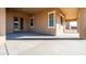 Covered patio with concrete flooring and access to the backyard at 1 N Brenner Pass Rd, Queen Creek, AZ 85144