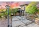 Pathway to the entrance of a unique home with stone and wood details at 16409 E Kingstree Blvd, Fountain Hills, AZ 85268