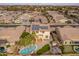 Aerial view of two story house with pool and solar panels at 1923 E Zion Way, Chandler, AZ 85249