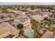 Aerial view of house with solar panels and pool at 1923 E Zion Way, Chandler, AZ 85249