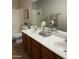 Functional bathroom with dual sinks and storage, designed for efficient and organized routines at 1923 E Zion Way, Chandler, AZ 85249