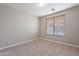 Spacious bedroom with neutral walls and carpeted floor at 1923 E Zion Way, Chandler, AZ 85249