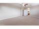 Bright bedroom with carpet, ceiling fan and access to bathroom at 1923 E Zion Way, Chandler, AZ 85249