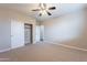 Bright bedroom with ceiling fan and spacious closet at 1923 E Zion Way, Chandler, AZ 85249