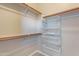 Walk-in closet with shelving and hanging rods at 1923 E Zion Way, Chandler, AZ 85249
