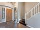 Elegant entryway with wood floors, a staircase, and a decorative tile inlay at 1923 E Zion Way, Chandler, AZ 85249