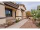 Front entrance with covered porch and desert landscaping at 1923 E Zion Way, Chandler, AZ 85249