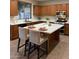 A large kitchen island featuring white countertops and lots of cabinet space at 1923 E Zion Way, Chandler, AZ 85249