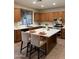 Well-appointed kitchen with stainless steel appliances, quartz countertops, and central island at 1923 E Zion Way, Chandler, AZ 85249