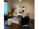 Chic home office with a white desk, stylish chairs, and wood-look flooring at 1923 E Zion Way, Chandler, AZ 85249