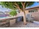 Outdoor kitchen with grill, stone countertops, and cabinets at 1923 E Zion Way, Chandler, AZ 85249