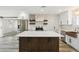 Bright, open kitchen featuring a large island, stainless steel appliances, and modern countertops at 2265 E Elmwood St, Mesa, AZ 85213