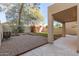 Backyard with gravel, artificial turf, and covered patio at 30417 N 42Nd Pl, Cave Creek, AZ 85331