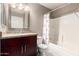 Bathroom with granite vanity, shower/tub combo, and flamingo shower curtain at 30417 N 42Nd Pl, Cave Creek, AZ 85331