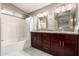 Double sink bathroom with granite countertop and large mirrors at 30417 N 42Nd Pl, Cave Creek, AZ 85331