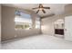 Carpeted bedroom with ceiling fan and ample natural light at 30417 N 42Nd Pl, Cave Creek, AZ 85331