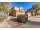 Two-story house with attached garage and landscaped front yard at 30417 N 42Nd Pl, Cave Creek, AZ 85331