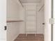 Large walk-in closet with shelving and hanging rods at 30768 N Royal Oak Way, San Tan Valley, AZ 85143