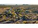 Aerial view of a luxury community with desert landscaping and mountain views at 35931 N 82Nd Pl, Scottsdale, AZ 85266
