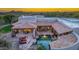 Aerial view of a stunning property with a pool and mountain backdrop at 35931 N 82Nd Pl, Scottsdale, AZ 85266