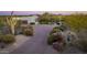 Aerial view of luxury home with driveway and desert landscaping at 35931 N 82Nd Pl, Scottsdale, AZ 85266