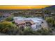Luxury home with desert landscape and mountain views at sunset at 35931 N 82Nd Pl, Scottsdale, AZ 85266