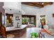 Home bar with stone countertop, opens to a relaxing patio area at 35931 N 82Nd Pl, Scottsdale, AZ 85266
