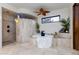 Relaxing bathroom with soaking tub and walk-in shower at 35931 N 82Nd Pl, Scottsdale, AZ 85266