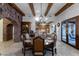 Elegant dining room features a large wood table and chandelier at 35931 N 82Nd Pl, Scottsdale, AZ 85266